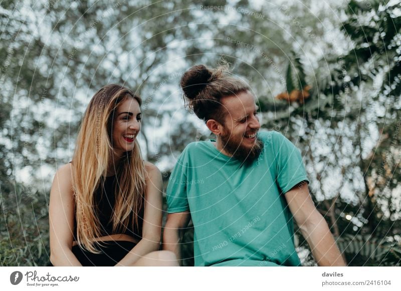 Young couple laughing outdoors Lifestyle Joy Happy Beautiful Woman Adults Friendship Couple 2 Human being 18 - 30 years Youth (Young adults) Nature Forest