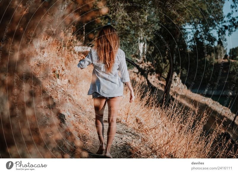 Barefoot woman walking along narrow path in nature. Lifestyle Mountain Hiking Human being Woman Adults 1 18 - 30 years Youth (Young adults) Nature Landscape