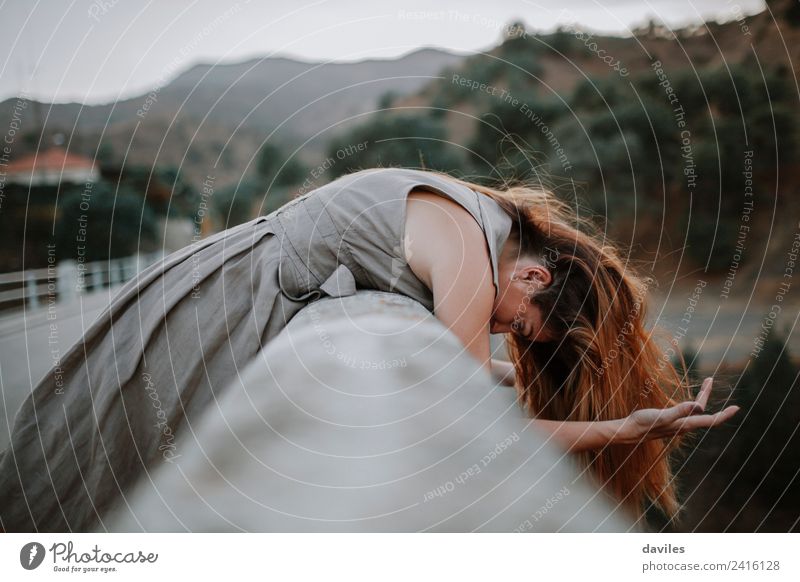 Alternative portrait of woman in a bridge over the river while wind moves her hair. Lifestyle Adventure Freedom Human being Woman Adults 1 18 - 30 years