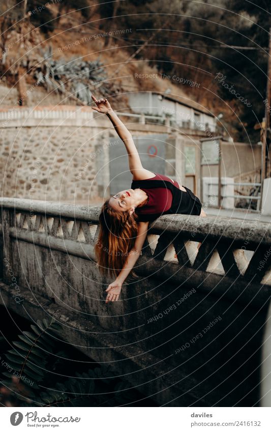 Blonde woman leaning out on a bridge with open arms, dancing. Lifestyle Beautiful Vacation & Travel Tourism Human being Feminine Woman Adults 1 18 - 30 years