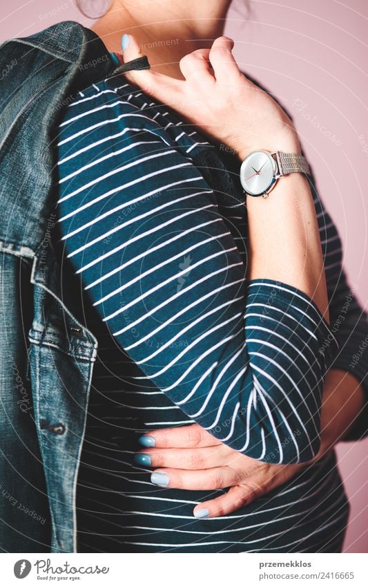 Woman wearing jeans jacket, blue blouse and silver wristwatch Lifestyle Style Clock Human being Young woman Youth (Young adults) Adults Body 1 18 - 30 years