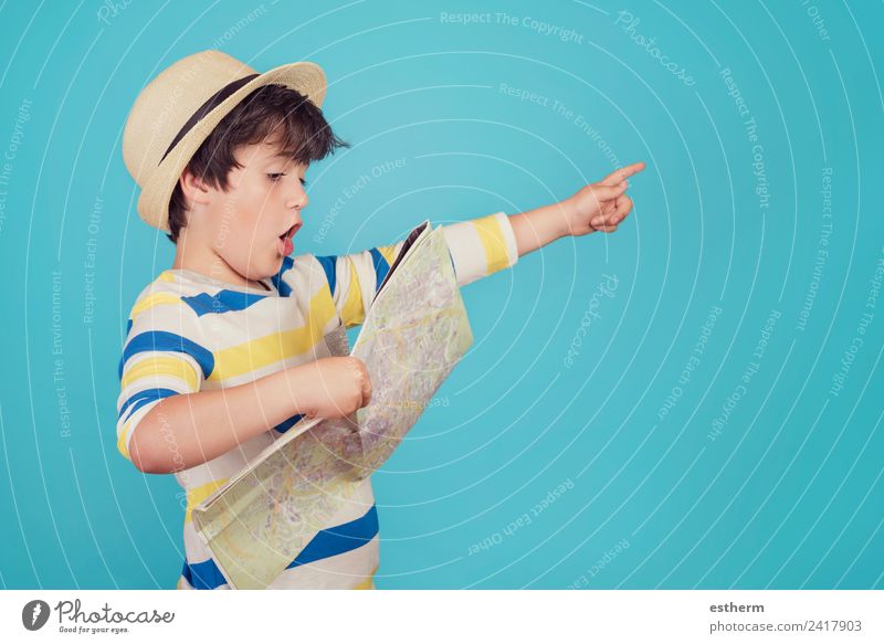 boy with hat and map on blue background Lifestyle Joy Vacation & Travel Tourism Trip Adventure Freedom Sightseeing City trip Cruise Summer vacation Human being