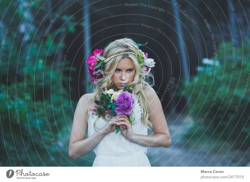 Beautiful blond woman with white dress and flowers in the forest Wedding Young woman Youth (Young adults) 1 Human being 18 - 30 years Adults Nature Plant Spring