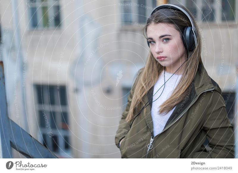 Girl listening music and looking at you Lifestyle Happy Contentment House (Residential Structure) Music School Headset Camera Technology Human being Feminine