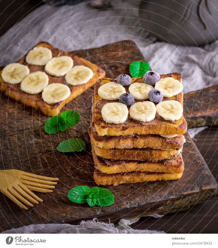 French toast for breakfast Fruit Bread Dessert Candy Nutrition Breakfast Fork Wood Eating Fresh Delicious Above Tradition french Banana chocolate background