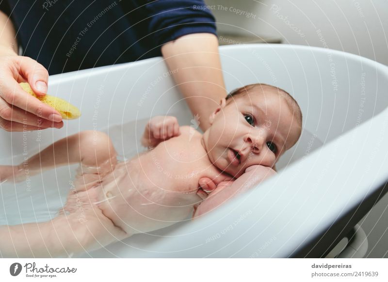 Newborn in the bathtub Lifestyle Beautiful Calm Bathtub Bathroom Child Human being Baby Woman Adults Mother Family & Relations Hand Authentic Small Modern Cute