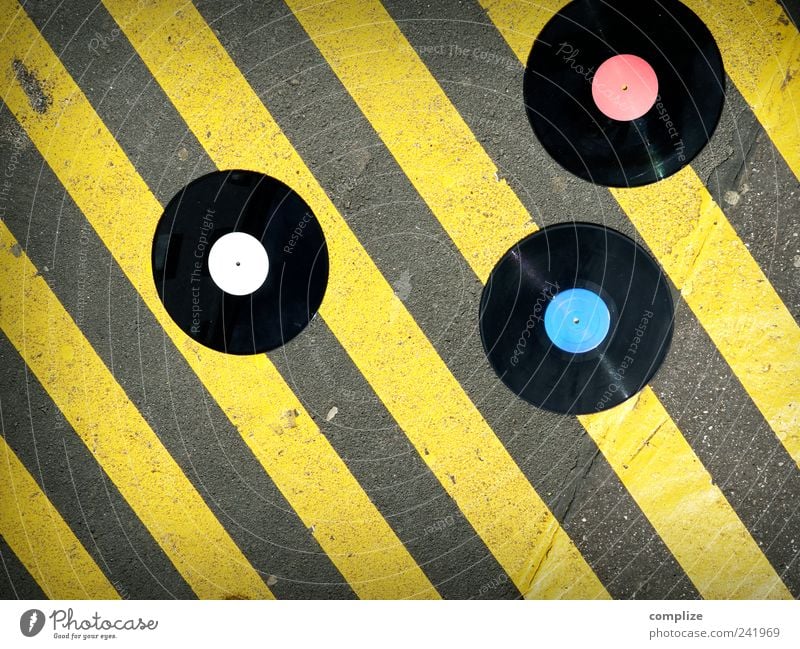vinyl Night life Entertainment Music Club Disco Disc jockey Going out Feasts & Celebrations Clubbing Dance Art Downtown Street Road sign Stone Concrete Yellow