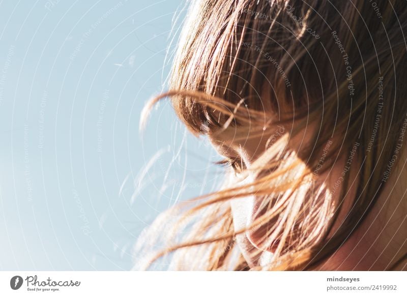 Portrait of a girl with hair blown by the wind Feminine Girl Face 1 Human being 3 - 8 years Child Infancy Sky Cloudless sky Sunlight Wind Hair and hairstyles