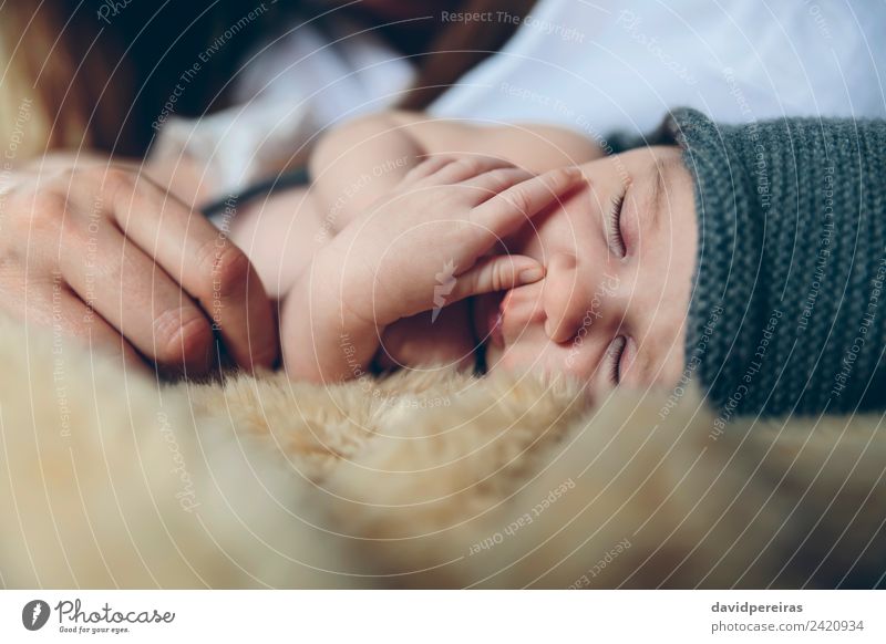 Baby sleeping on a blanket with her mother's hand Beautiful Calm Bedroom Child Human being Woman Adults Mother Family & Relations Hand Hat Love Sleep Authentic