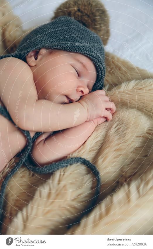 Newborn baby with pompom hat sleeping on blanket Beautiful Calm Bedroom Child Human being Baby Woman Adults Warmth Hat Sleep Authentic Small Naked Cute