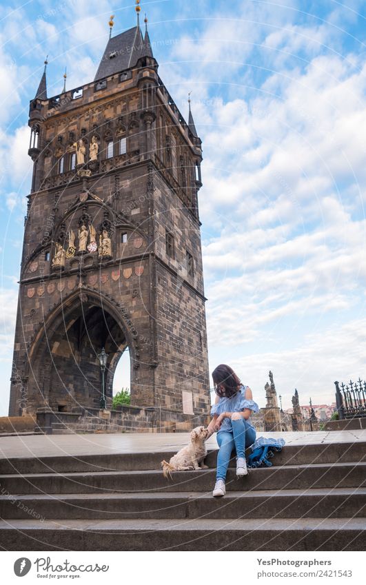 Woman with a dog in front of the tower of Charles Bridge Lifestyle Beautiful Relaxation Vacation & Travel Summer Adults Friendship Art Beautiful weather