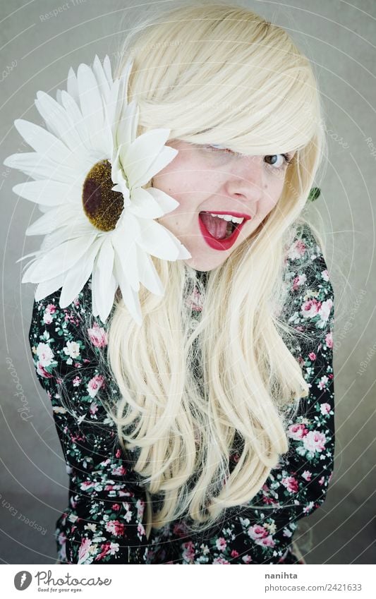 Cheerful blonde woman posing with a huge daisy Lifestyle Style Joy Beautiful Hair and hairstyles Face Wellness Human being Feminine Young woman