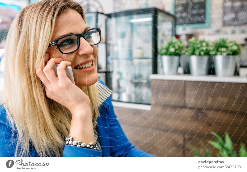 Woman talking on phone in a cafe Coffee Lifestyle Shopping Joy Happy Beautiful Leisure and hobbies Work and employment To talk Telephone PDA Technology