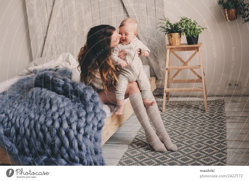 happy mother and baby playing at home in bedroom Lifestyle Joy Playing Bedroom Baby Parents Adults Mother Family & Relations Kissing Love Embrace Happiness