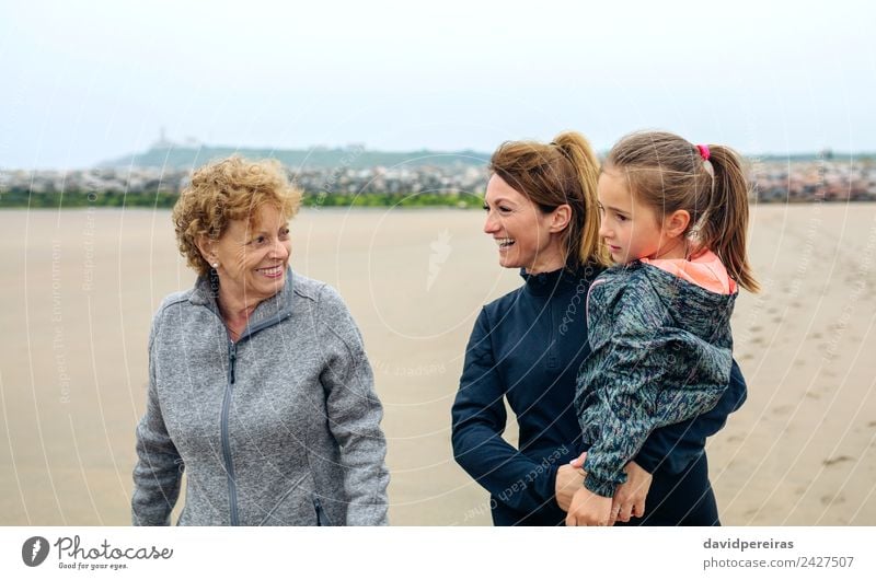 Three generations female walking on the beach Lifestyle Joy Happy Beautiful Beach Child Human being Woman Adults Mother Grandmother Family & Relations Sand Sky