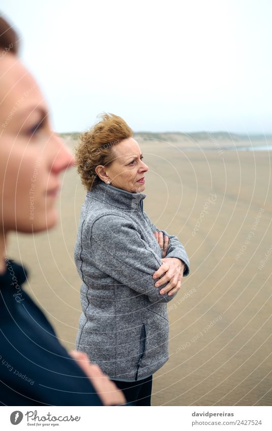 Two women looking at sea Lifestyle Beautiful Meditation Beach Ocean Human being Woman Adults Mother Grandmother Family & Relations Sand Autumn Wind Fog Love