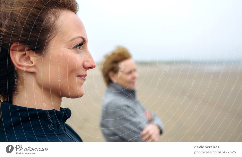 Women looking at sea on beach Lifestyle Joy Beautiful Meditation Beach Ocean Human being Woman Adults Mother Grandmother Family & Relations Sand Autumn Wind Fog