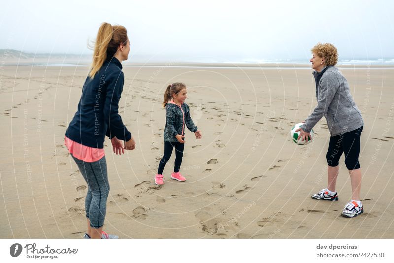 Three generations female playing on the beach Lifestyle Joy Happy Playing Beach Child Human being Woman Adults Mother Grandmother Family & Relations Sand Autumn