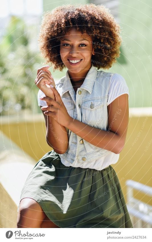 blYoung black woman, afro hairstyle, smiling outdoors Lifestyle Style Happy Beautiful Hair and hairstyles Face Human being Woman Adults Street Fashion Brunette