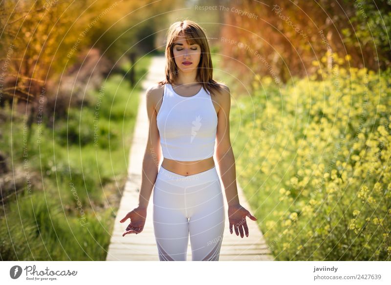 Young woman doing yoga in nature Lifestyle Happy Beautiful Body Relaxation Meditation Summer Sports Yoga Human being Youth (Young adults) Woman Adults 1