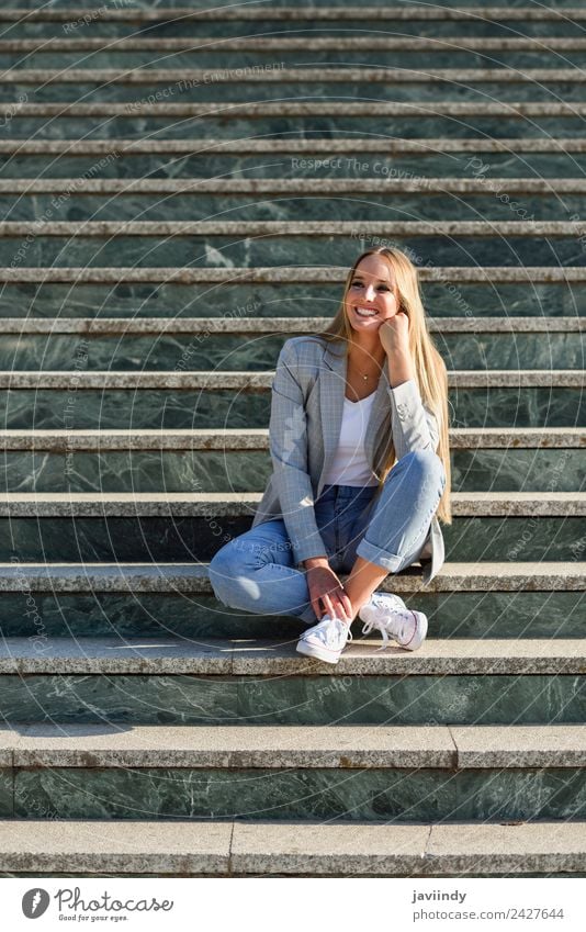 Blonde woman smiling in urban background Lifestyle Style Happy Beautiful Hair and hairstyles Human being Woman Adults Autumn Street Fashion Clothing Jeans