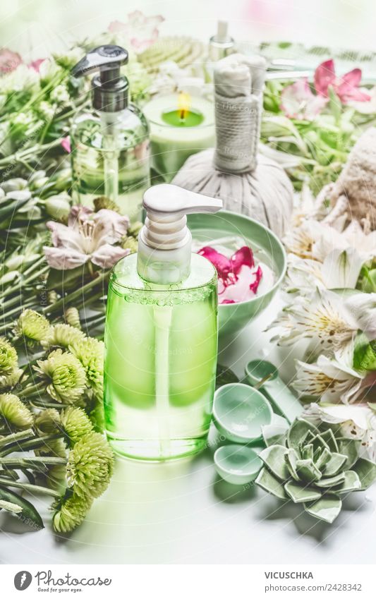 Green cosmetics bottle with flowers and spa accessories Style Design Beautiful Personal hygiene Cosmetics Cream Healthy Health care Medical treatment Wellness
