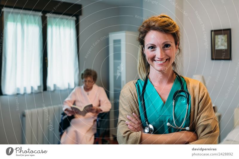 Pretty female doctor in a geriatric clinic with elderly woman in wheelchair Happy Health care Illness Relaxation Reading Bedroom Doctor Hospital Human being
