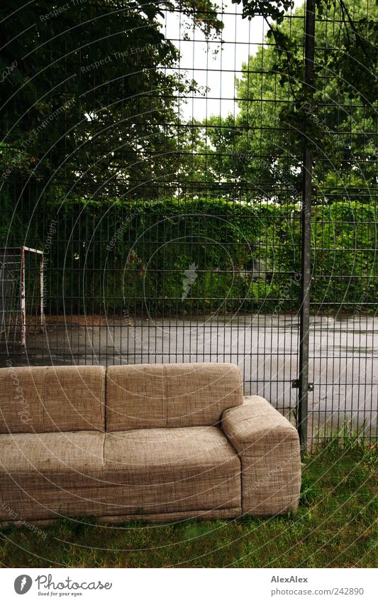 Offside couch Leisure and hobbies Playing Football pitch Furniture Sofa Sporting Complex Subculture Hedge Tree Park St. Pauli Fence Grating Observe Looking Sit