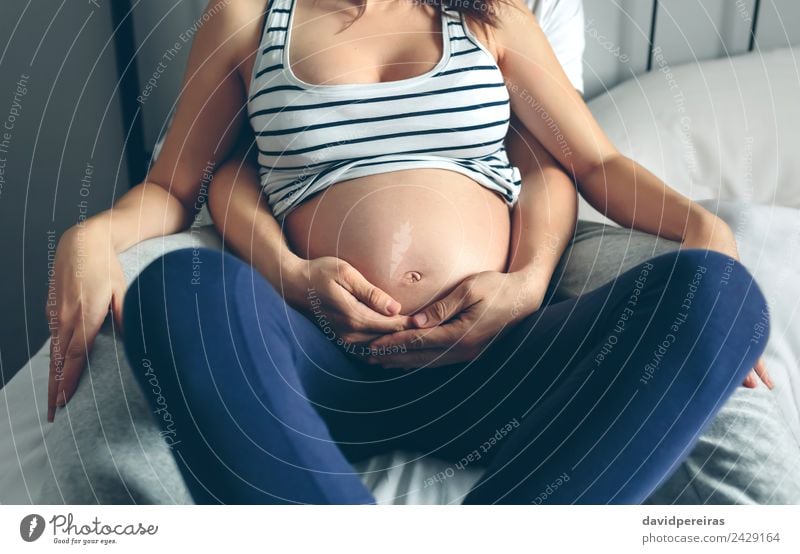 Safety pin depicted as family, pregnancy - a Royalty Free Stock Photo from  Photocase