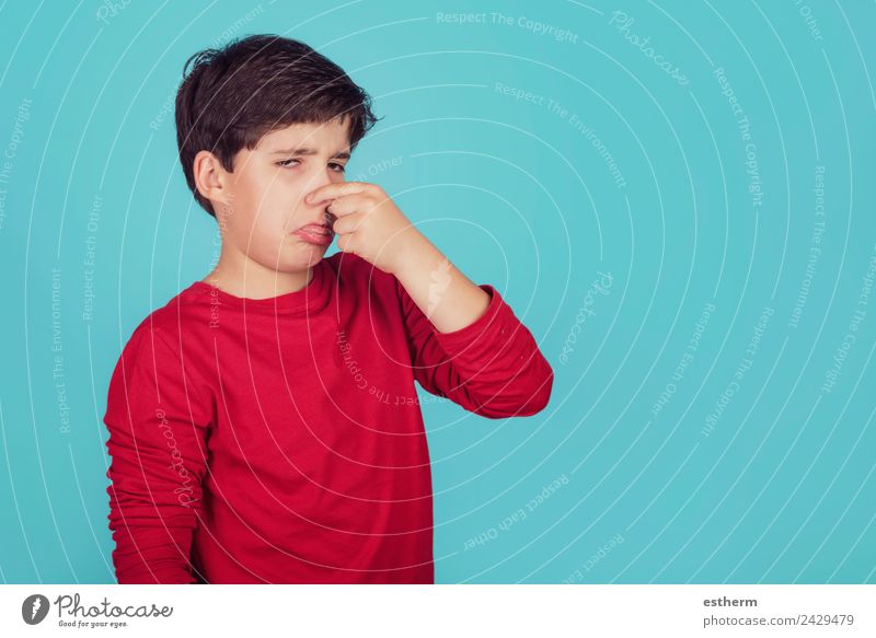boy with hand in nose on blue background Lifestyle Personal hygiene Human being Masculine Child Toddler Boy (child) Infancy 1 8 - 13 years Breathe Fragrance