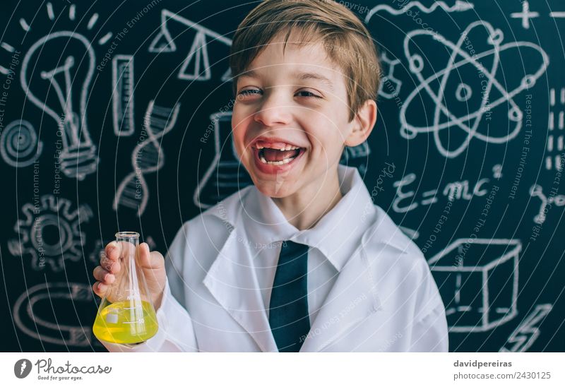 Happy little scientist laughing while holding flask Playing Flat (apartment) Science & Research Child Classroom Blackboard Laboratory Human being Boy (child)