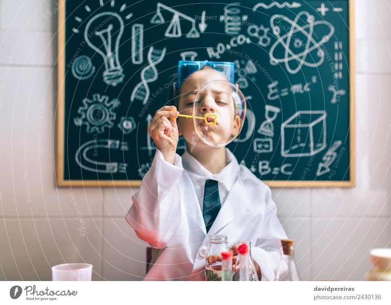 Kid doing soap bubbles against of drawn blackboard Joy Happy Playing Flat (apartment) Science & Research Child School Classroom Blackboard Laboratory