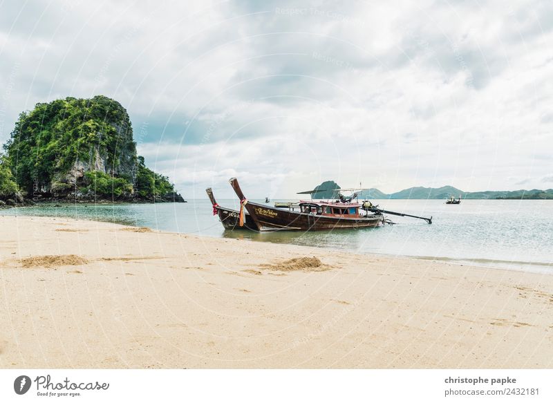 Longtail boats lie on the beach of an island in Thailand Vacation & Travel Far-off places Summer Summer vacation Beach Ocean Island Landscape Clouds Warmth