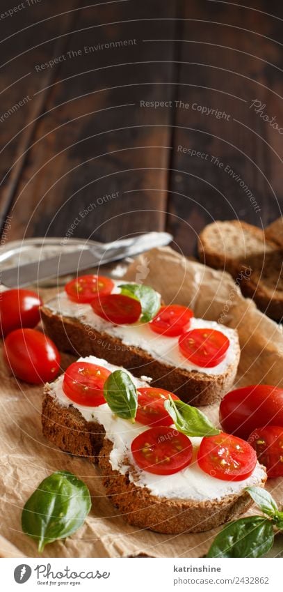 Bruschetta with cream cheese, cherry tomatoes and basil Cheese Bread Eating Breakfast Lunch Fresh Green Red appetizer Baguette board bruschetta cooking Dairy