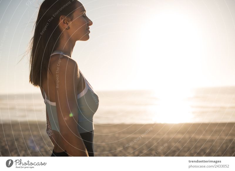 Woman enjoying beautiful sunset on the beach Lifestyle Happy Beautiful Harmonious Relaxation Meditation Vacation & Travel Freedom Summer Sun Beach Ocean Yoga