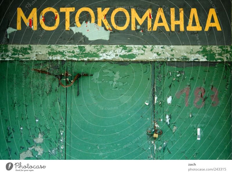 Motokomanda House (Residential Structure) Ruin Wall (barrier) Wall (building) Garage Car Motorcycle Wood Sign Characters Digits and numbers Ornament
