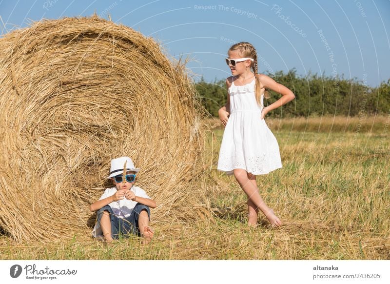 Happy children playing on the field Lifestyle Joy Beautiful Face Leisure and hobbies Playing Vacation & Travel Freedom Summer Child School Human being