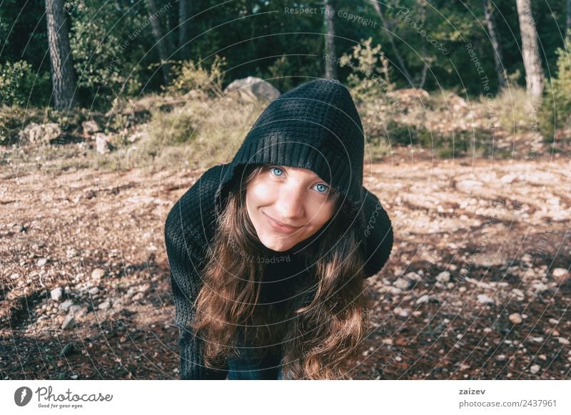 a girl with long hair and blue eyes in the mountains smiling with a hood Lifestyle Happy Beautiful Face Relaxation Freedom Mountain Human being Feminine