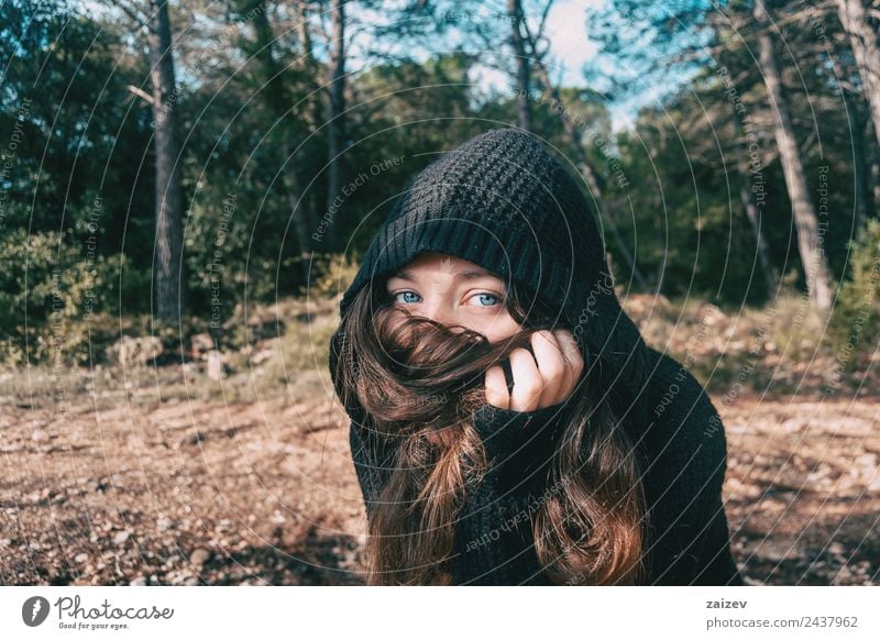 a girl with long hair and blue eyes in the mountain covering her face with her hair Lifestyle Elegant Style Happy Beautiful Face Relaxation Freedom Mountain