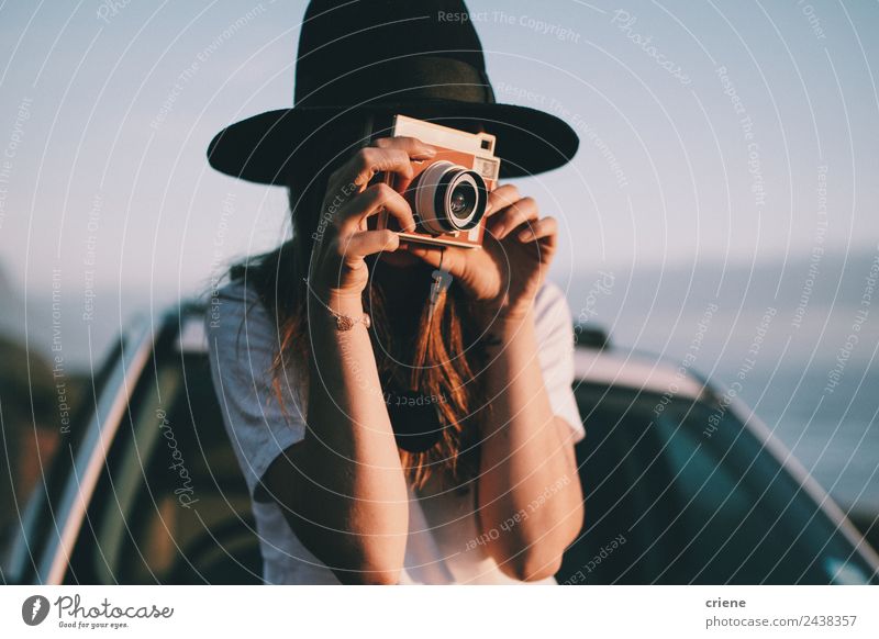 young woman taking picture with retro camera on roadtrip Lifestyle Joy Beautiful Leisure and hobbies Vacation & Travel Trip Summer Camera Human being Woman