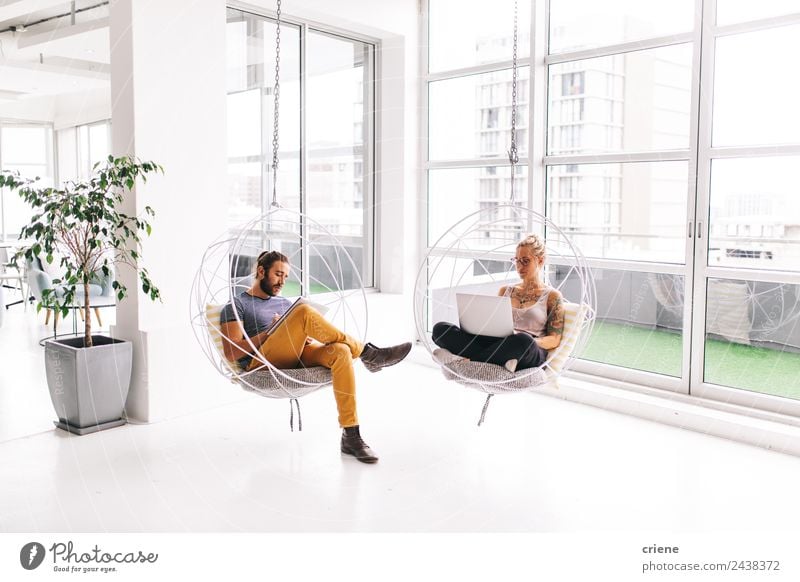 young man and woman working next to each other in office Relaxation Calm Furniture Chair Work and employment Profession Office Business Company Computer