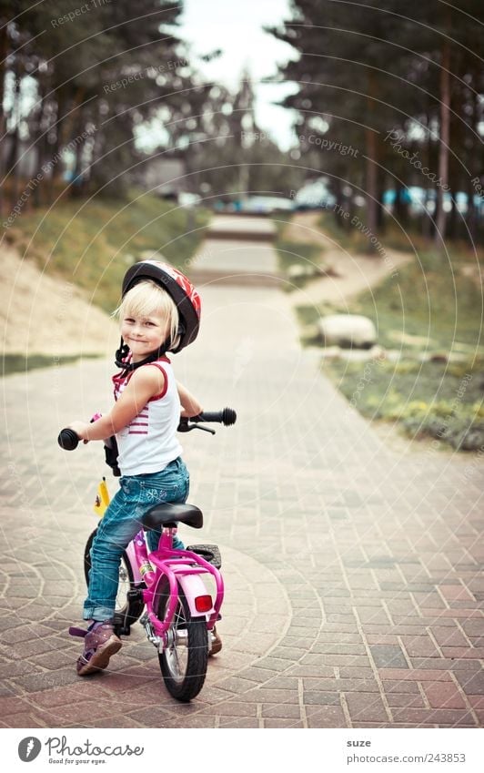 shoulder look Cycling Bicycle Child Human being Toddler Girl Infancy 1 3 - 8 years Tree Traffic infrastructure Lanes & trails Helmet Blonde Stand Wait Small