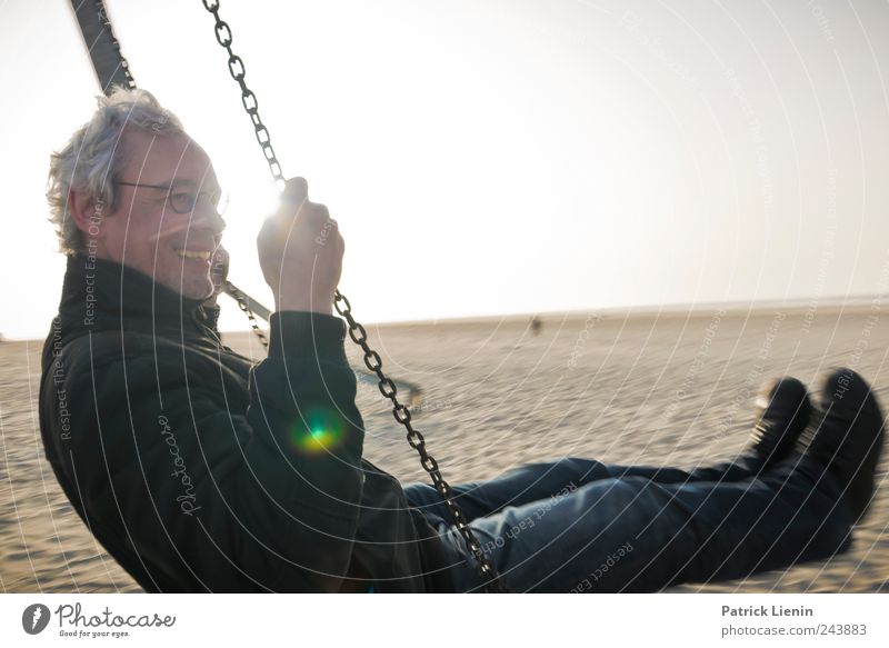 Spiekeroog Life is good. Joy Playing Trip Freedom Sun Rope Human being Man Adults Legs Environment Sky Beautiful weather Movement To hold on Flying To swing