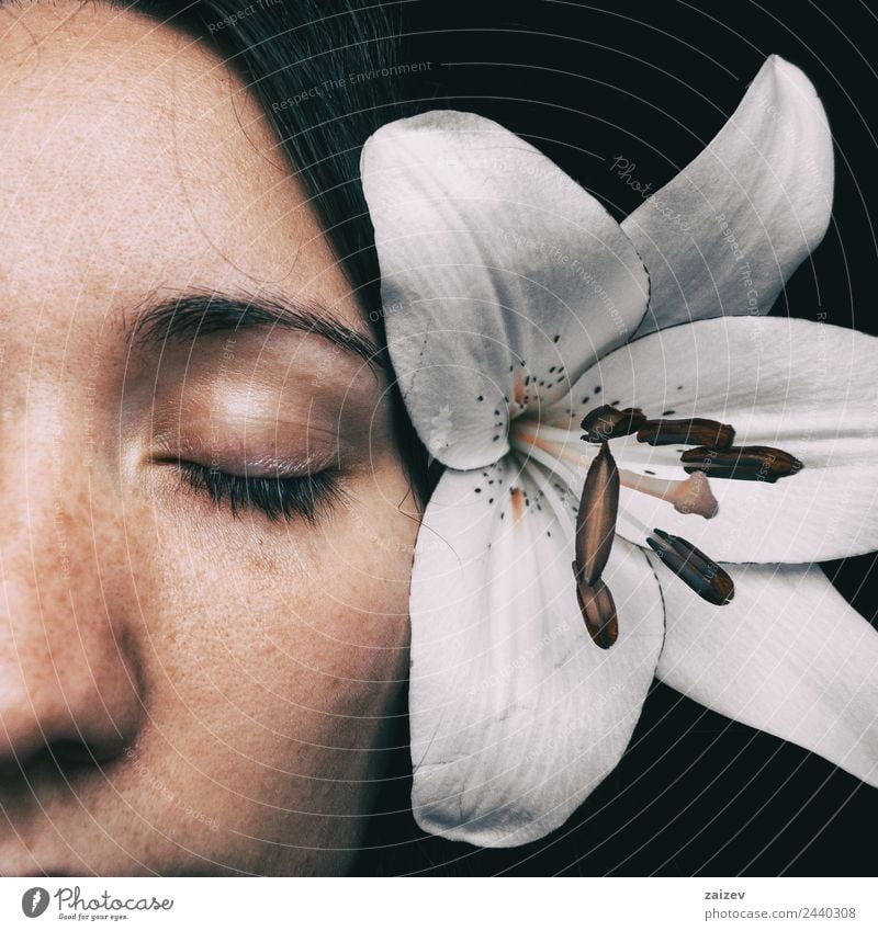 half of a girl's face with a white lily and closed eyes Lifestyle Beautiful Skin Face Healthy Health care Relaxation Calm Fragrance Valentine's Day Human being