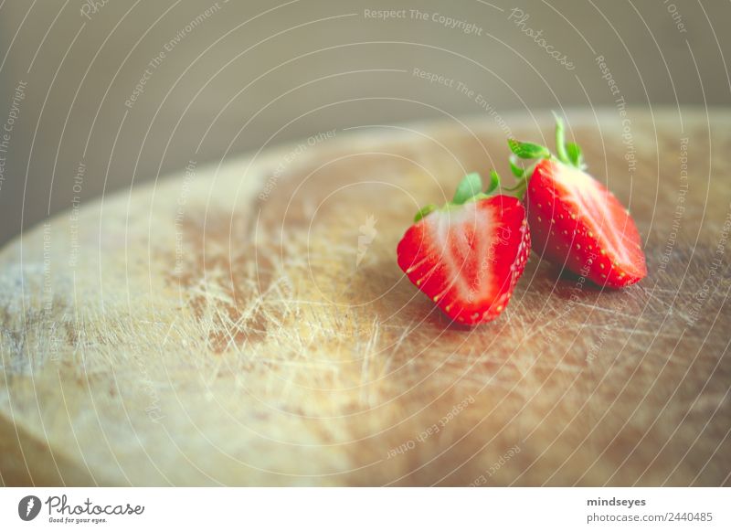 A sliced strawberry on a wooden board Fruit Strawberry Nutrition Vegetarian diet Fasting Wooden board Summer Kitchen Nature Plant Eating Fitness To enjoy