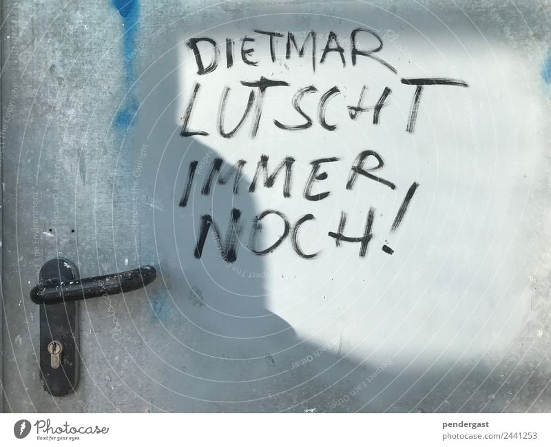 Dietmar lutscht immer noch! Pen Metal Signs and labeling Dirty Homosexual Funny Subdued colour Exterior shot Detail Deserted Central perspective