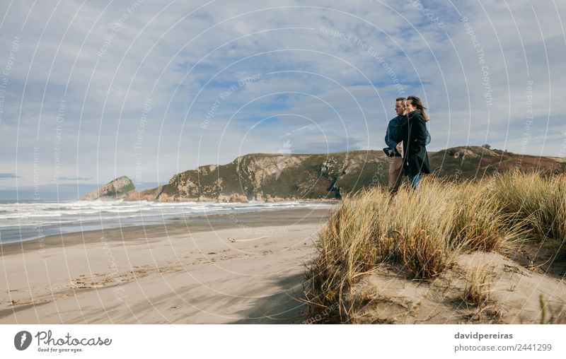 Couple looking at the sea Lifestyle Calm Leisure and hobbies Beach Ocean Waves Winter Woman Adults Man Parents Family & Relations Nature Landscape Sand Autumn