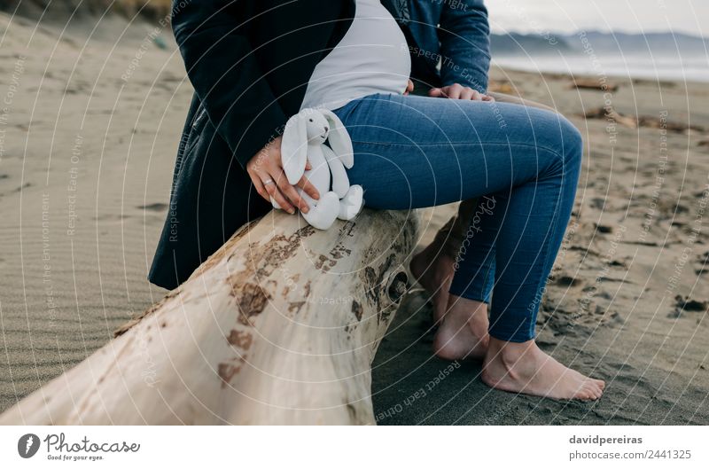 Pregnant on the beach with her partner Lifestyle Beach Ocean Winter Human being Woman Adults Man Mother Father Couple Partner Feet Sand Autumn Jeans Coat
