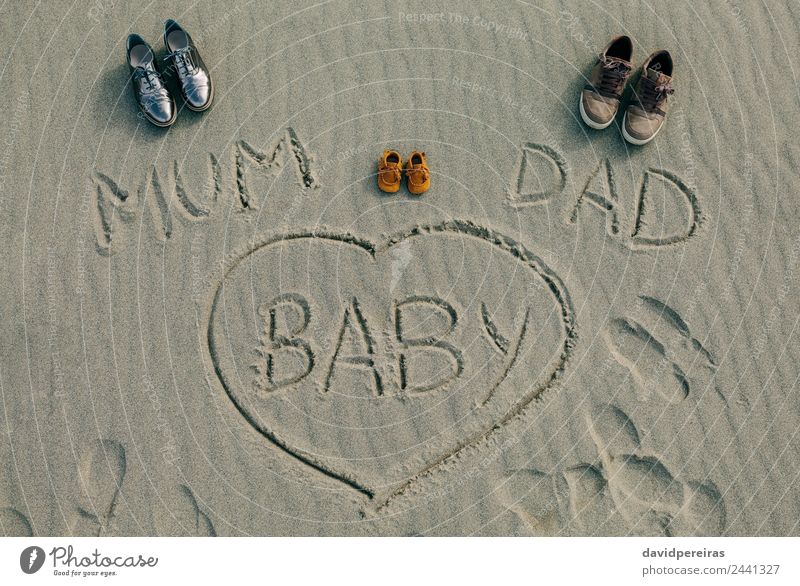 Mum, dad and baby written on the sand of the beach Beach Winter Baby Parents Adults Mother Father Family & Relations Couple Sand Autumn Footwear Heart Love