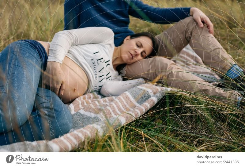 Pregnant sleeping on a blanket on the grass Lifestyle Relaxation Human being Baby Woman Adults Man Father Family & Relations Couple Nature Autumn Grass Meadow